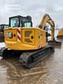 2021 Caterpillar 308 mini excavator, rear three-quarter view