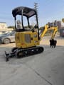 2022 Caterpillar 301.7 Mini Excavator with a front three-quarter view showing the dozer blade and tracks.