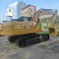2025 Caterpillar 320GX crawler excavator, rear three-quarter view