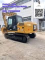 2023 Caterpillar 313D2 GC crawler excavator, rear three-quarter view