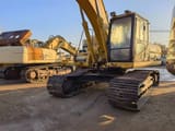 2010 Caterpillar 325BL crawler excavator, front three-quarter view