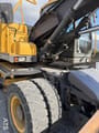 2009 Volvo EW140C wheel excavator side view