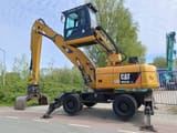 2010 Caterpillar M322D Material Handler