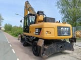 2010 Caterpillar M322D Material Handler