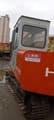 2010 Hitachi EX60 crawler excavator, rear three-quarter view