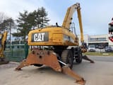2011 Caterpillar 325D Material Handler