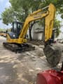 2012 Komatsu PC-55MR mini excavator, front three-quarter view
