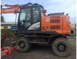 2014 Hitachi Zaxis 140W wheel excavator, side profile view