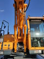2014 Hyundai R140W-9 wheel excavator, close-up of cab and boom