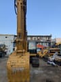 Excavadora de orugas Caterpillar 320CL 2018, vista frontal del brazo y cucharón
