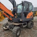 2018 Doosan DX60W wheel excavator, front three-quarter view