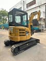 2020 Caterpillar 303 CR mini excavator, rear three-quarter view