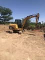 2020 Caterpillar 305.5 mini excavator, rear three-quarter view