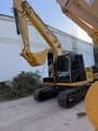 2021 Caterpillar 313D2 GC crawler excavator, front three-quarter view
