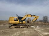 2021 Caterpillar 320GC crawler excavator, side view
