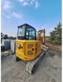 2022 Caterpillar 304 crawler excavator rear three-quarter view