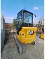 2022 Caterpillar 304 crawler excavator, rear three-quarter view