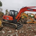 2022 Doosan DH55 mini excavator, side view
