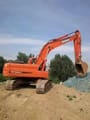 2022 Doosan DX225LC crawler excavator, rear three-quarter view