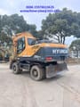 2022 Hyundai R210W-9 wheel excavator, rear three-quarter view