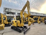 2022 Komatsu PC56-7 mini excavator, front three-quarter view