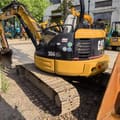 2023 Caterpillar 304CR mini excavator, rear three-quarter view