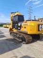 2023 Caterpillar 320D2 crawler excavator, rear three-quarter view