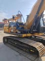 2023 Caterpillar 320D2 crawler excavator, side view