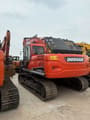 2023 Doosan DX225LC-9C crawler excavator, rear three-quarter view