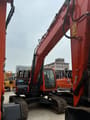 2023 Doosan DX225 crawler excavator, front three-quarter view