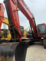 2023 Doosan DX225 crawler excavator, front view