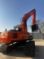 2023 Hitachi Zaxis 210 crawler excavator, rear three-quarter view