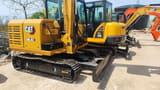 2024 Caterpillar 305.5E2 mini excavator, rear three-quarter view