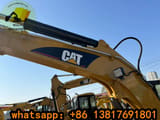 2023 Caterpillar 303CCR mini excavator, front three-quarter view
