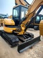 2024 Caterpillar 304 mini excavator, front three-quarter view