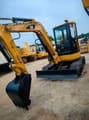 2024 Caterpillar 304 mini excavator, front three-quarter view
