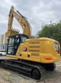2024 Caterpillar 320GC crawler excavator, rear three-quarter view