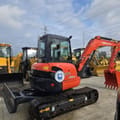 2024 Kubota U55-4 mini excavator, front three-quarter view