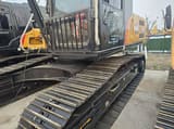 2024 Sany SY235 crawler excavator, side view of cab and tracks