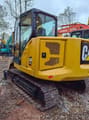 2025 Caterpillar 307.5 crawler excavator, rear three-quarter view
