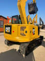 2025 Caterpillar 307.5 mini excavator rear three-quarter view