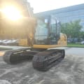 2025 Caterpillar 320GX crawler excavator, front three-quarter view