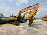 2025 Sany SY215H Crawler Excavator with its yellow boom and arm extended forward, showcasing the black digging bucket.