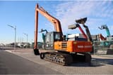 2025 Tata Hitachi EX215LC Crawler Excavator, side view, showing the full length of the tracks and undercarriage.
