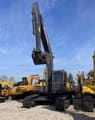 2025 Volvo EC240 crawler excavator, front view with raised boom