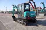 2026 Sunward SWE60E Mini Excavator with its teal body, featuring a close-up of the cab and the 'SUNWARD' branding.