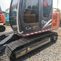 Hitachi ZX70 crawler excavator side view of the cab and tracks