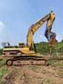 2006 Caterpillar 345B L crawler excavator side view with hydraulic breaker