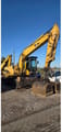 2006 Caterpillar M318CMH wheel excavator, side profile view