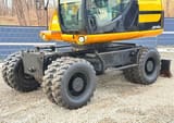 2011 JCB JS145W wheel excavator side view